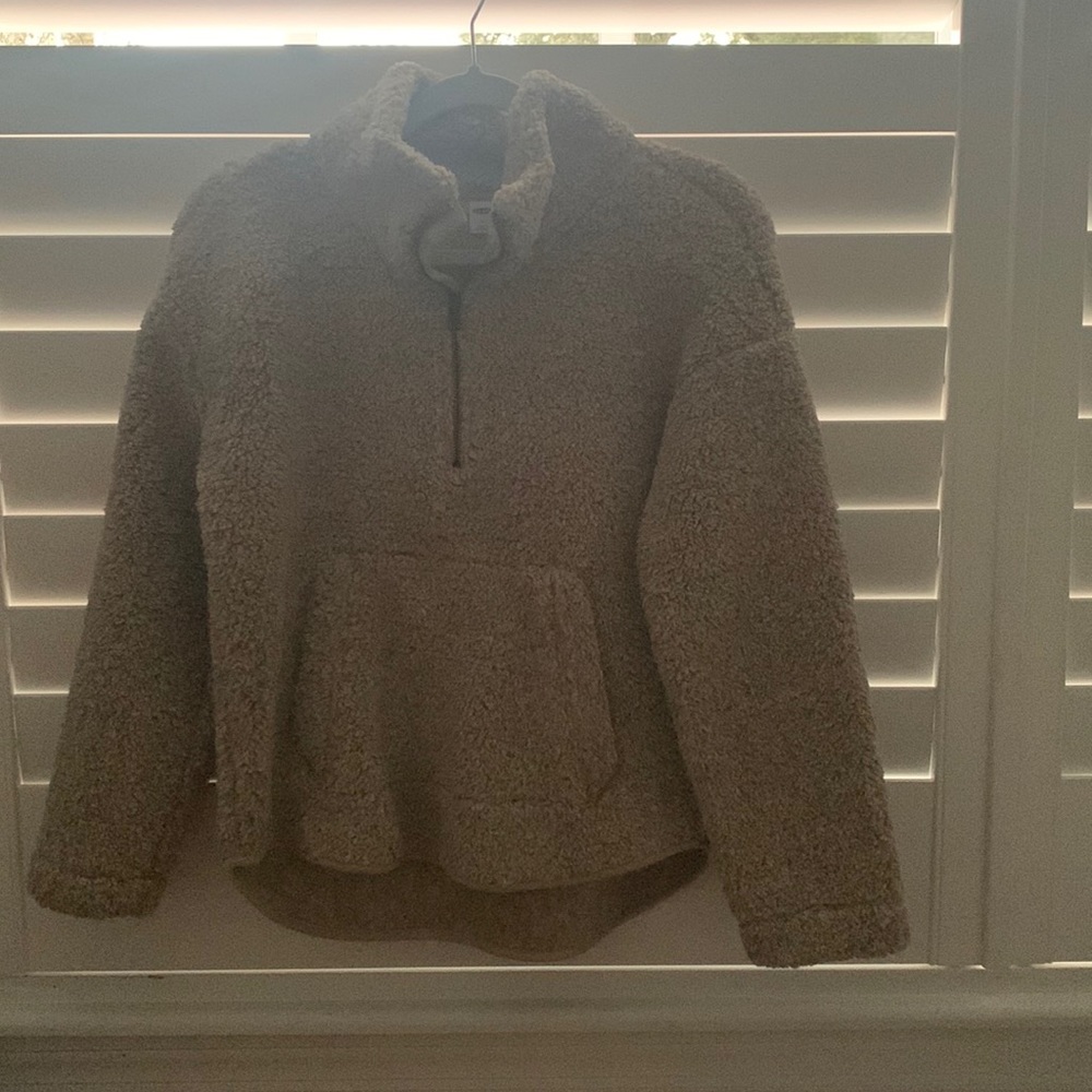 Size XS, color tan, very soft, zipper works great, and very comfy.